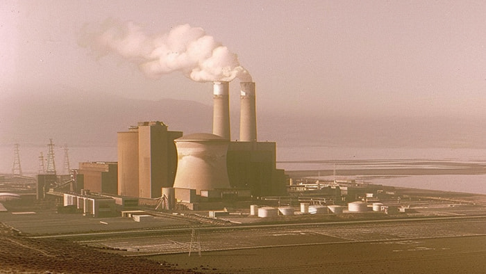 The Windscale nuclear facility in the UK with smoke rising from the fire